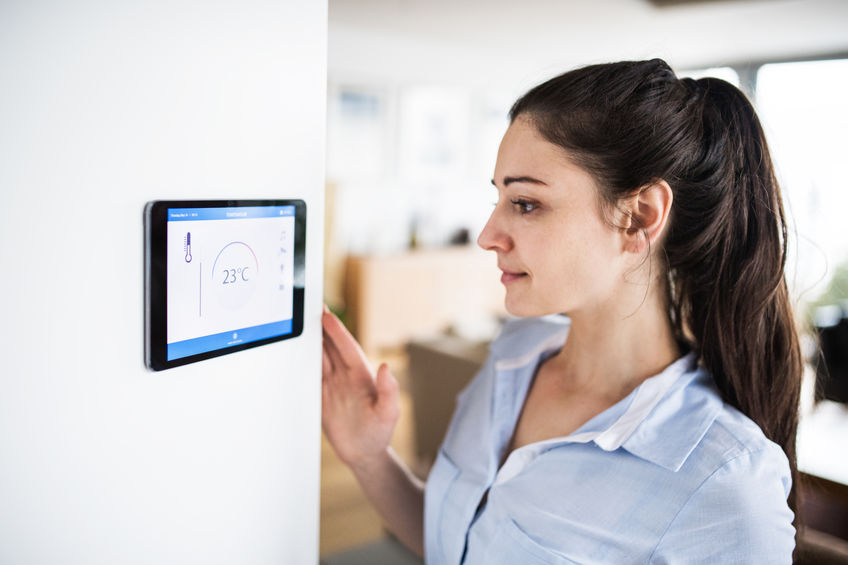 Woman Configuring Wireless Security System