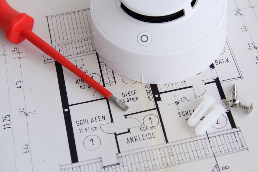 a commercial smoke detector is on a floor plan