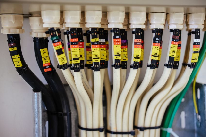 A close up of structured wiring cables in a business