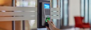 Employee fingers pushing down on access control to get into office doors