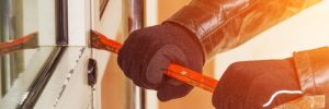Burglar trying to break into home with a crowbar