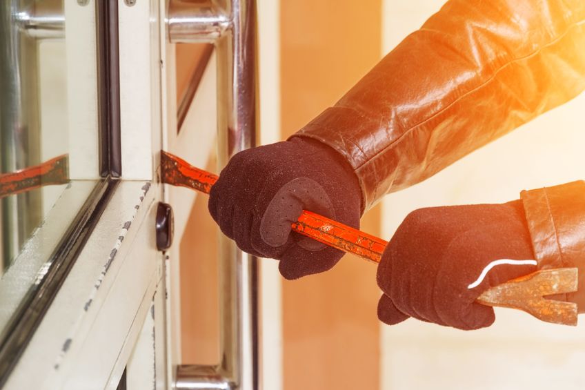 Burglar trying to break into home with a crowbar